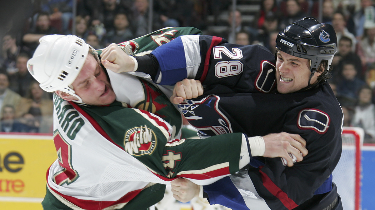 NHL enforcers fighting during a game