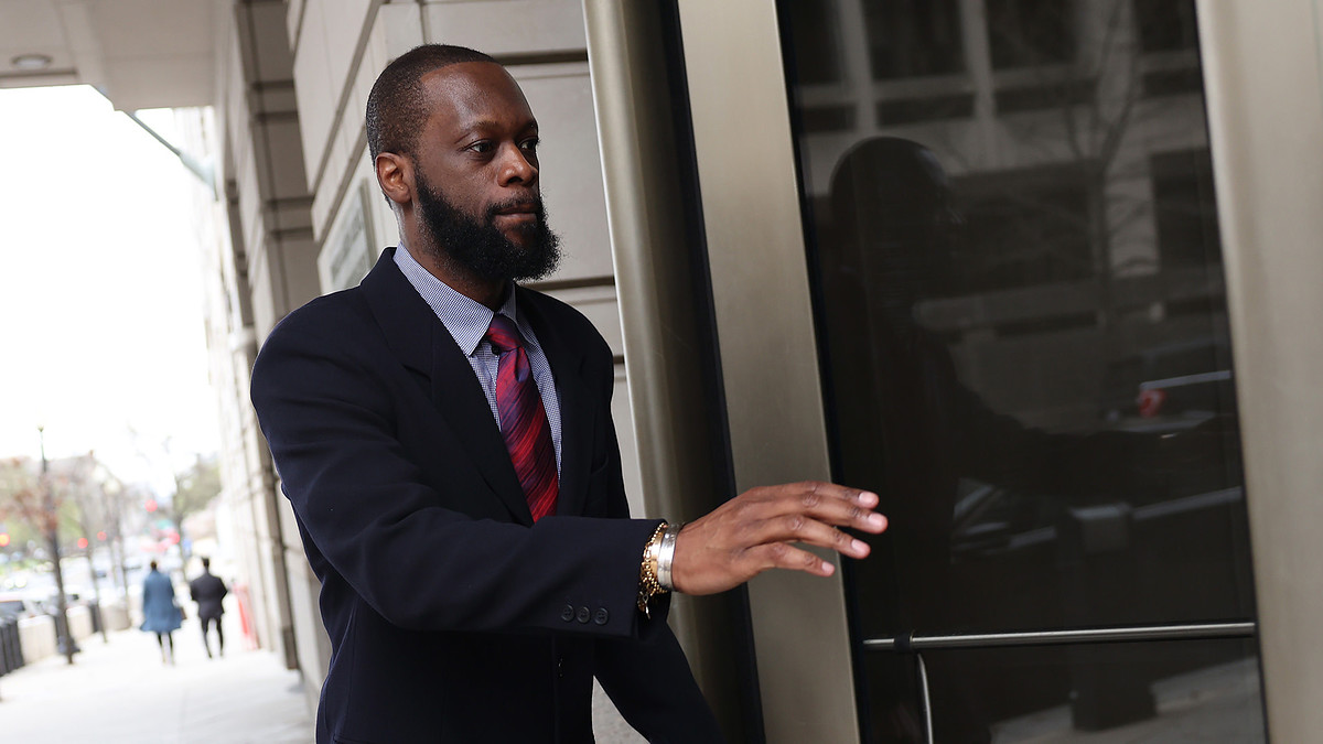 Pras Michel, a member of the 1990's hip-hop group the Fugees, arrives at U.S. District Court