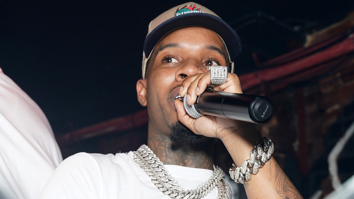 Tory Lanez with microphone in hand