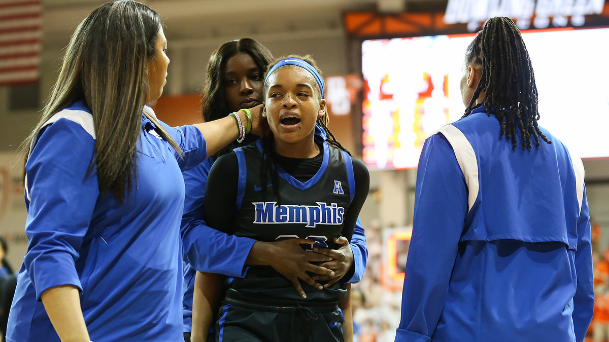 Memphis Tigers guard Jamirah Shutes (23) is escorted off of the court after an altercation