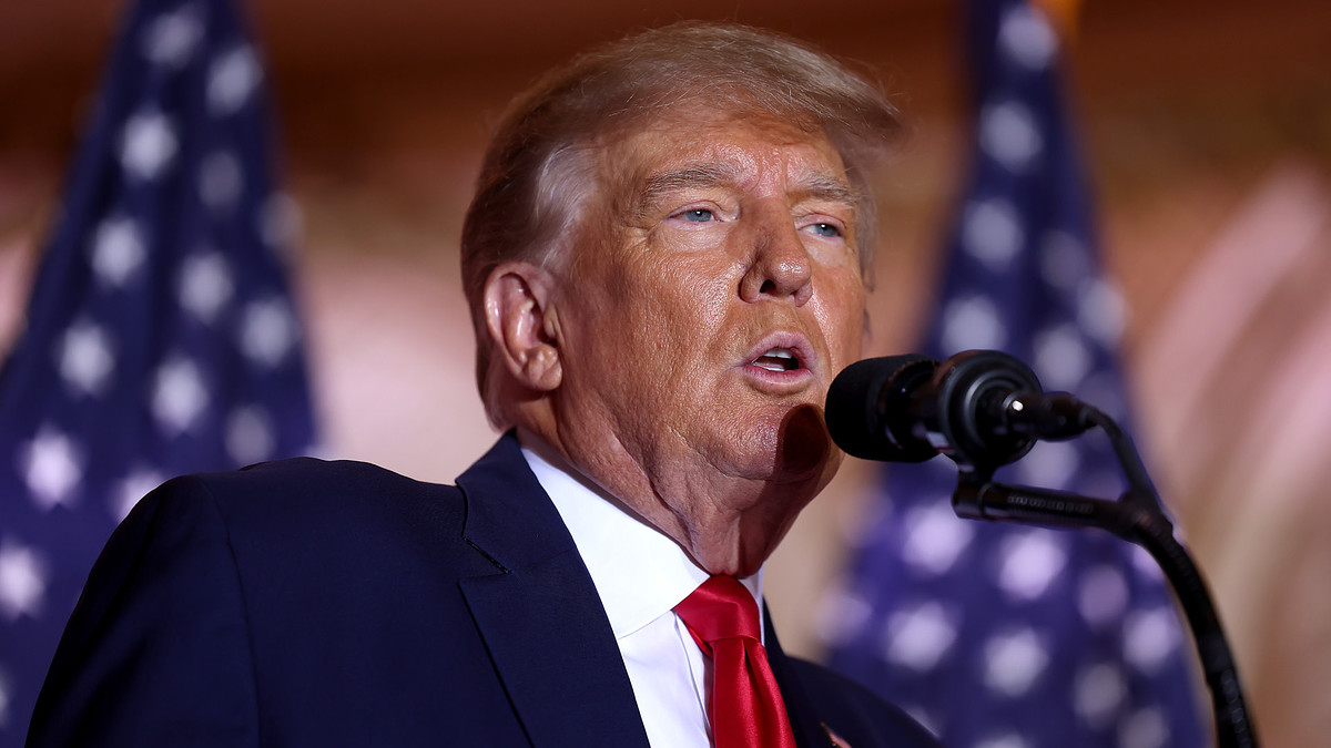 Trump is seen speaking into mic