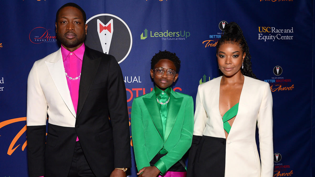 This is an image of Dwyane Wade, Zaya Wade, and Gabrielle Union-Wade
