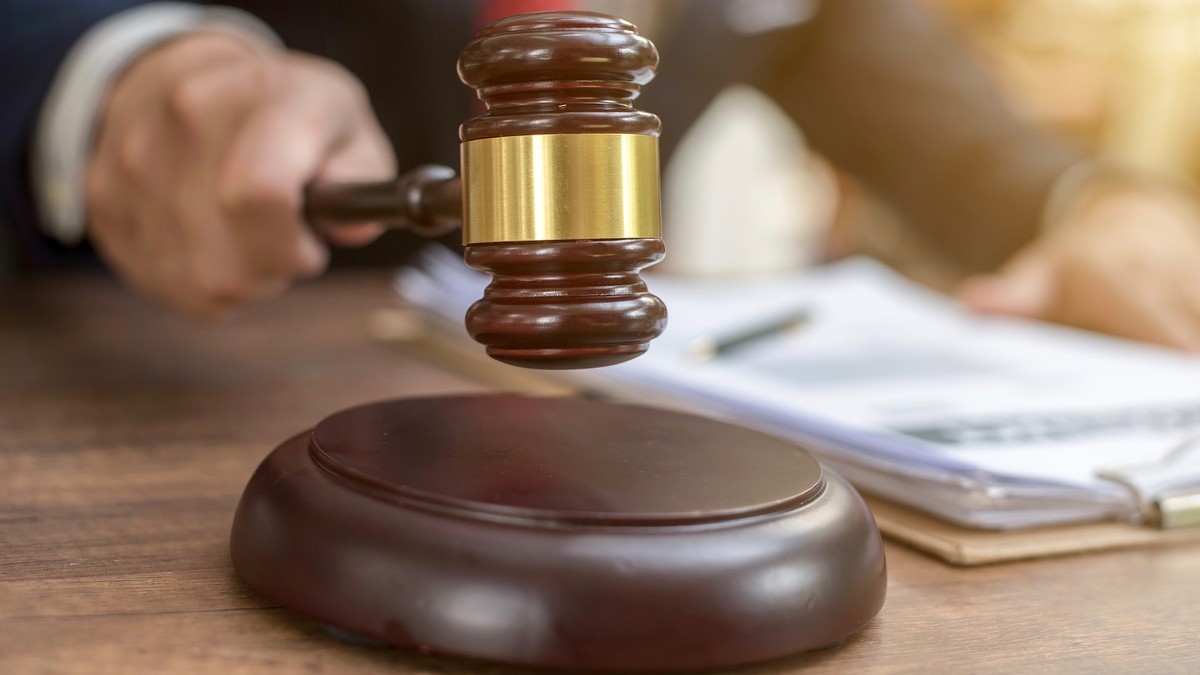 Close up lawyer businessman working or reading lawbook in office workplace
