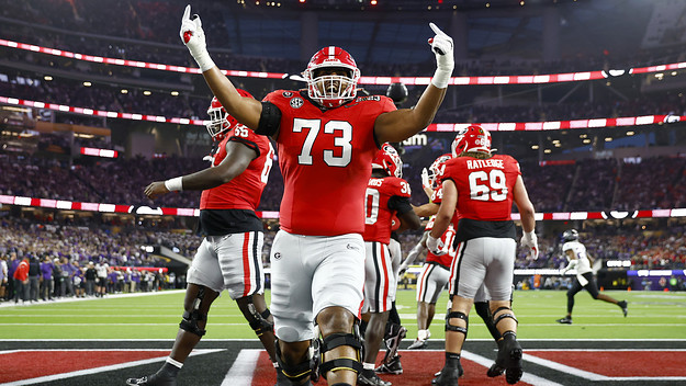 UGA player Xavier Truss celebrates after his team scores a touchdown.