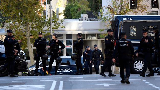 Spanish police stand guard near the United States Embassy in Madrid on Thursday