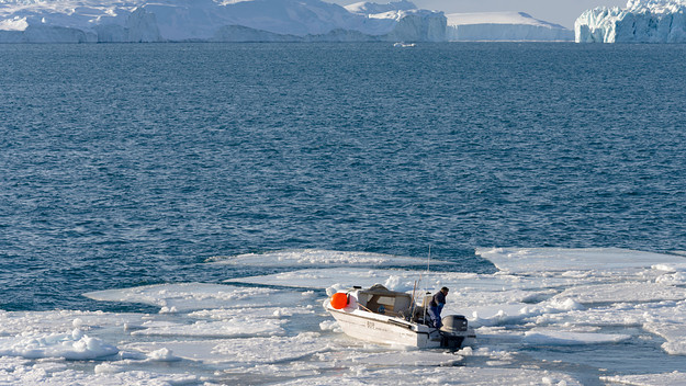 Fisherman fishing in the fjord