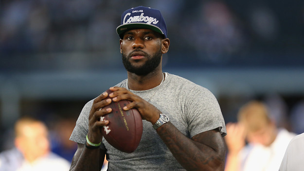 Lebron James throws a football at AT&T Stadium before Giants and Cowboys game.