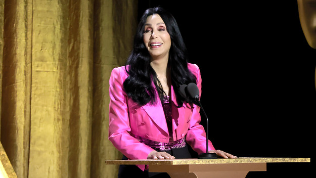 Cher speaks onstage during the Academy of Motion Picture Arts and Sciences