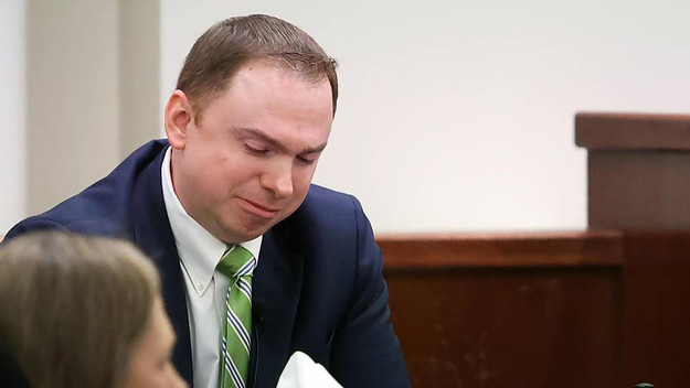 Defendant Aaron Dean reacts on the stand while testifying on Monday, Dec. 12, 2022