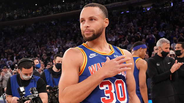 Stephen Curry celebrates setting the NBA's most three pointers made record.