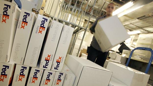 FedEx courier Nate Channing makes a pickup of packages from a Gump's store December 8, 2006