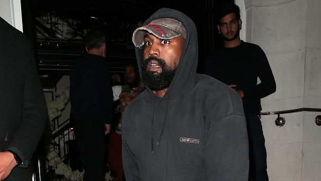 Kanye wearing a hat facing left