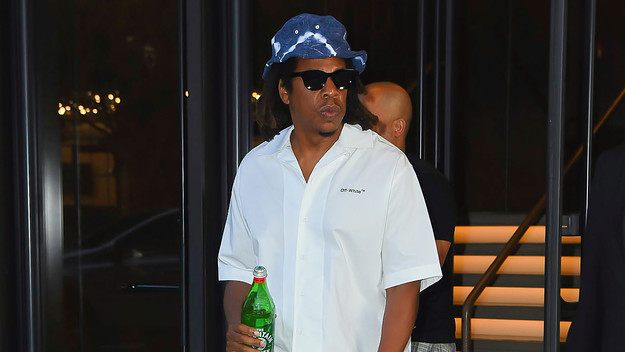 Jay Z is seen holding a bottle of water