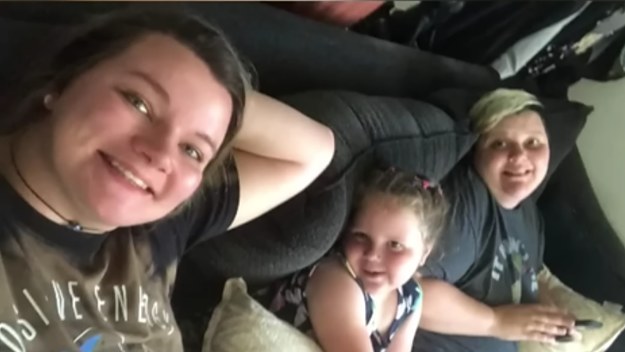 A photo of the same-sex couple and their child who couldn't attend kindergarten in a Louisiana school.