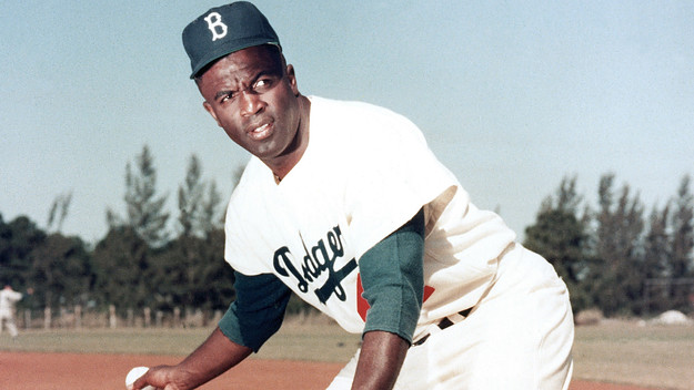Jackie Robinson photographed with glove