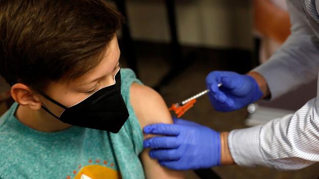 Child getting vaccinated for COVID 19