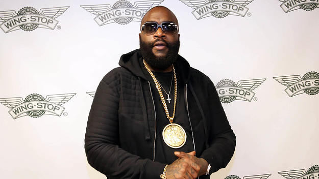 Rick Ross on red carpet at Wingstop event