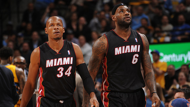 Ray Allen #34 and LeBron James #6 of the Miami Heat look on against the Denver Nuggets