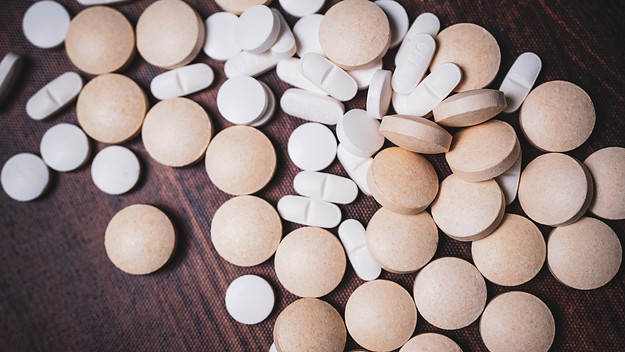 Pills representing the dangers of drug interaction