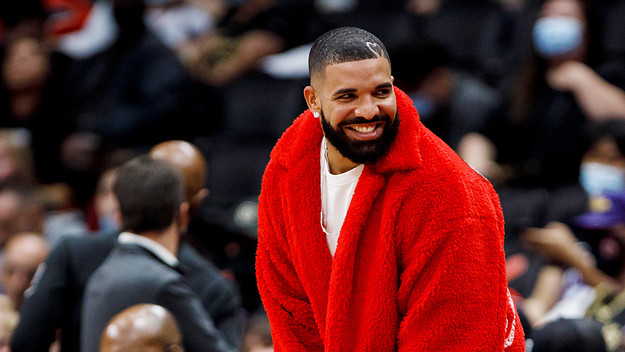 Drake attends a preseason NBA game between the Toronto Raptors and the Houston Rockets