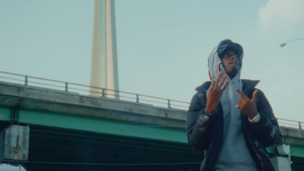 Toronto rapper Houdini smoking in front of the CN Tower