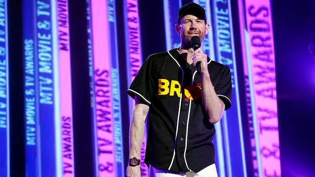 Billy Eichner is pictured speaking to a crowd