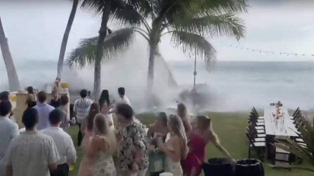 waves hit wedding reception in Hawaii