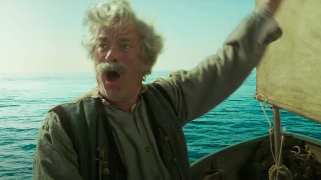 Tom Hanks is seen wavnig on a boat