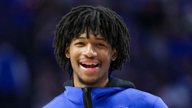 Shaedon Sharpe #21 of the Kentucky Wildcats looks on during halftime against the Florida Gators at Rupp Arena on February 12, 2022 in Lexington, Kentucky
