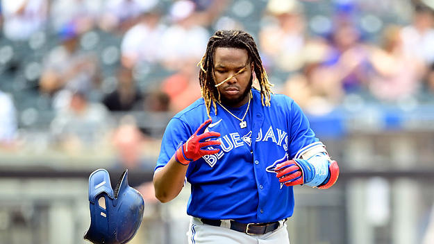 Vladimir Guerrero Jr. #27 of the Toronto Blue Jays tosses his helmet after flying out against the New York Mets