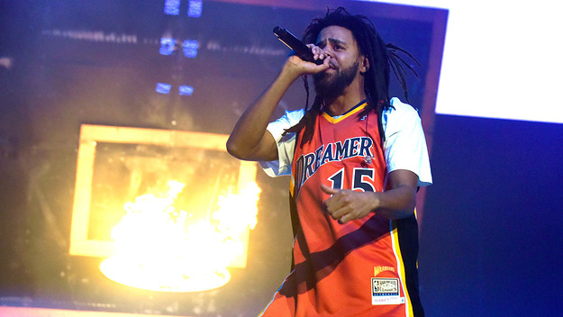 J Cole is seen performing at a show for fans