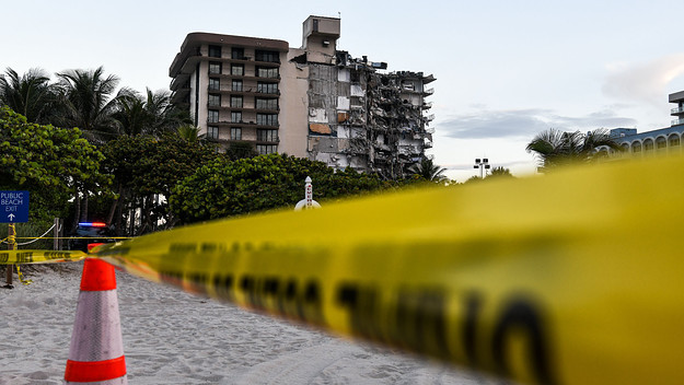 Police tape blocks access to partially collapsed Surfside condo.