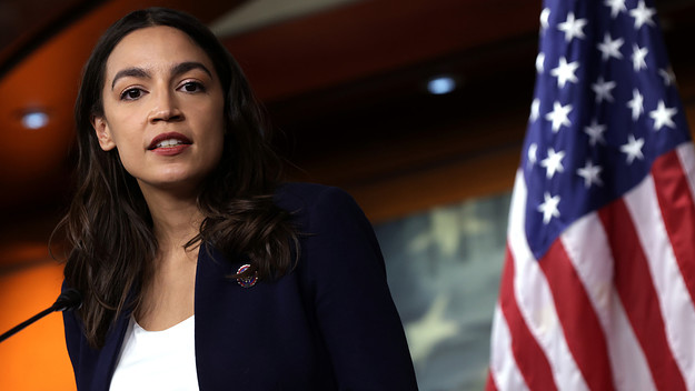 Alexandria Ocasio Cortez is pictured speaking at a podium