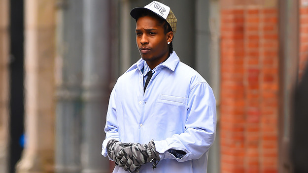 ASAP Rocky is pictured outside wearing gloves and a hat