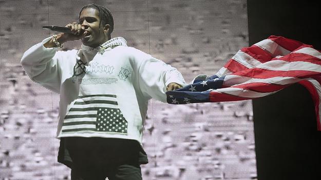Rocky onstage with flag in hand