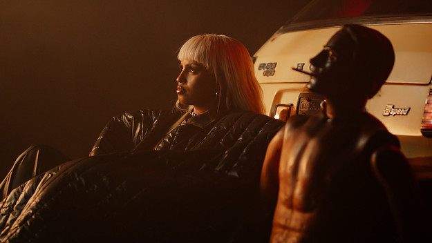 IDMAN sitting beside a crash test dummy