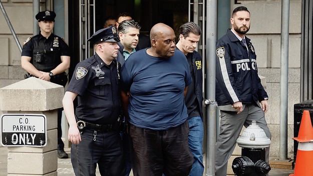 Suspected subway shooter, Frank James is escorted out by the FBI and NYPD officers