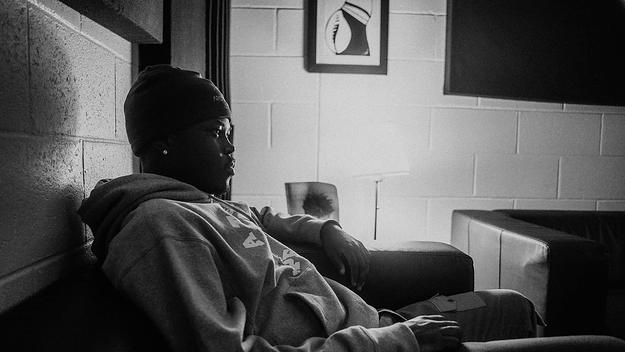 Montreal rapper Skiifall sitting backstage