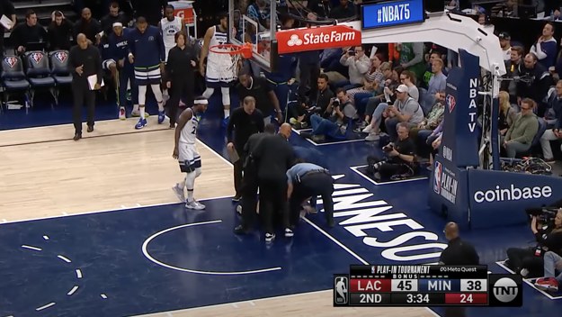 Woman tries to glue herself to target center court during game
