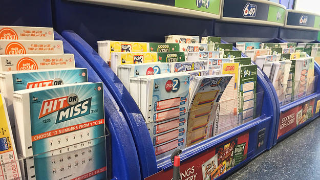 Lottery number selection slips seen at a shop as the largest lottery jackpot in Canadian history