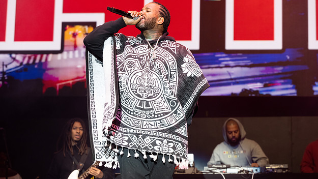 The Game is seen performing at a festival