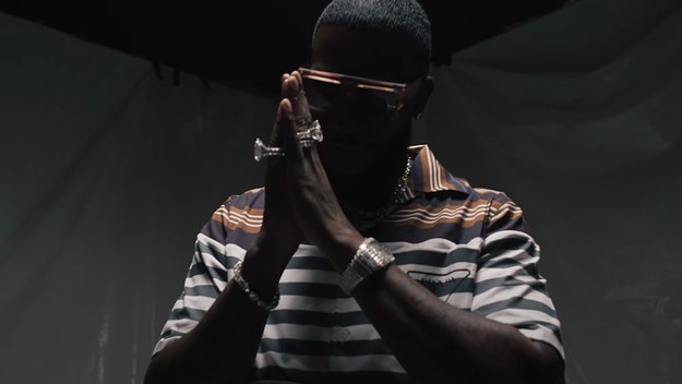 Gucci Mane is seen holding up his hands