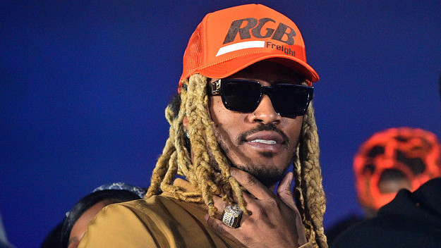 Future is seen smiling at a photographer