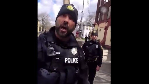 A police officer is pictured arguing with a witness