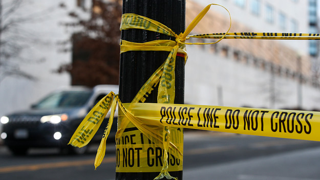 Yellow tape is pictured in a blocked street.