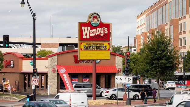 Cars pass the Wendys in Dave Thomas Circle in Washington, D.C.