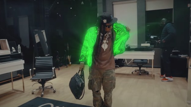 Takeoff is seen in his new music video
