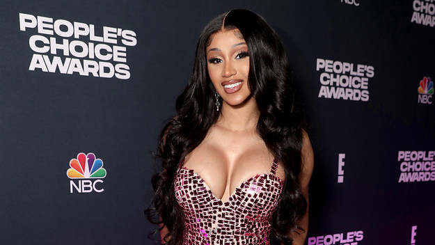 Cardi B poses for photo backstage at an awards show.