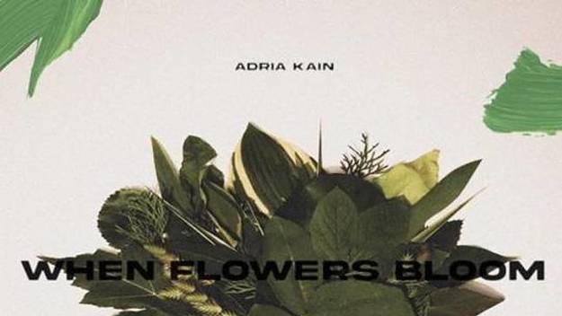 A beige background with strokes of green paint and foliage in the middle. Black text reads "Adria Kain", then "When Flowers Bloom"