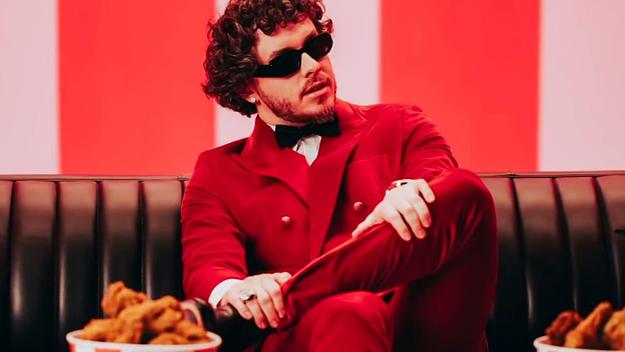Jack Harlow poses with a bucket of chicken